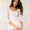 Babydoll-genser med kabelstrikk