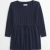Babydoll-genser med kabelstrikk