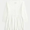 Babydoll-genser med kabelstrikk