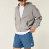 Baggy fotballshorts til midt på låret