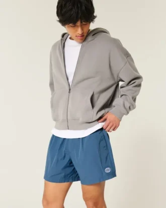 Baggy fotballshorts til midt på låret