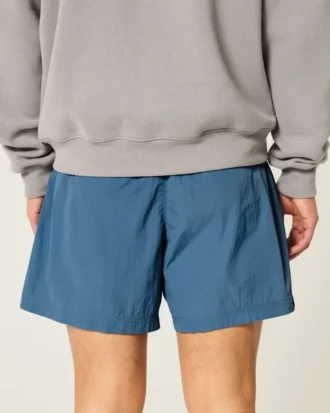 Baggy fotballshorts til midt på låret