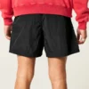 Baggy fotballshorts til midt på låret