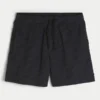 Baggy fotballshorts til midt på låret