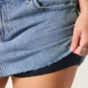 Curvy lavt sittende miniskjørt i mediumvasket denim