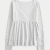Enkel langermet babydoll-top med pointelle