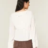 Enkel langermet babydoll-top med volanger