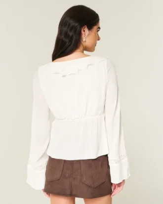 Enkel langermet babydoll-top med volanger
