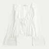 Enkel langermet babydoll-top med volanger