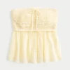 Enkel stroppeløs babydoll-top i heklet blanding