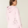 Hettegenser med glidelås og rose-motiv