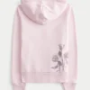 Hettegenser med glidelås og rose-motiv