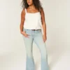 Høy midje, lys vask, stjerneformet lomme, flare-jeans