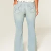 Høy midje, lys vask, stjerneformet lomme, flare-jeans