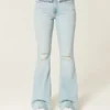 Høy midje, revne, lysevaskede flare-jeans