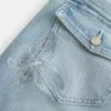 Lav midje, medium vask, brodert butterfly bootcut-jeans