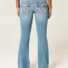 Lav midje, medium vask, broderte blomster, bootcut-jeans