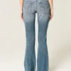 Lav midje, slitt, medium vasket bootcut-jeans