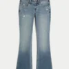 Lav midje, slitt, medium vasket bootcut-jeans