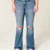 Lavmidje, rippede bootcut-jeans i medium vask