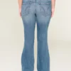 Lavmidje, rippede bootcut-jeans i medium vask