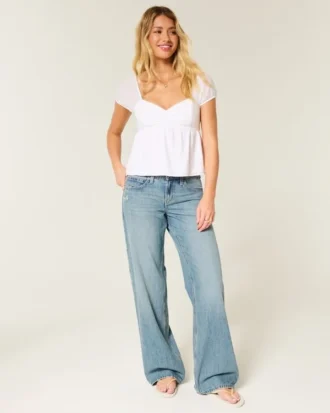 Lavt sittende baggy jeans med medium vask og sommerfuglmotiv