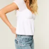 Lavt sittende baggy jeans med medium vask og sommerfuglmotiv