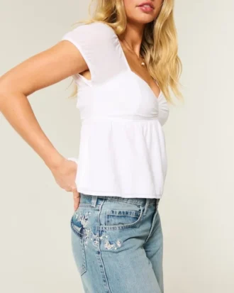 Lavt sittende baggy jeans med medium vask og sommerfuglmotiv