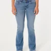Lavt sittende bootcut-jeans i medium vask
