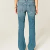 Lavt sittende bootcut-jeans med medium vask og nitter