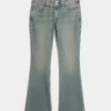 Lavt sittende bootcut-jeans med sommerfuglbroderi i medium vask