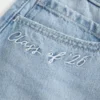 Lavt sittende Class of ’26 denim miniskjørt