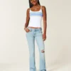 Lavt sittende, lettvasket bootcut-jeans med broderi og rift