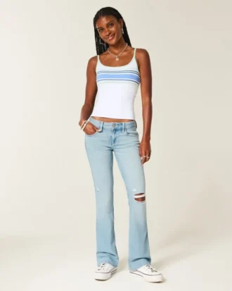 Lavt sittende, lettvasket bootcut-jeans med broderi og rift