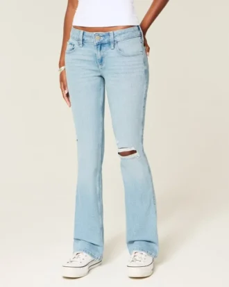 Lavt sittende, lettvasket bootcut-jeans med broderi og rift