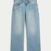 Lavt sittende, lysvasket baggy jeans med kjede-broderi