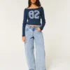 Lavt sittende, lysvasket, koniske baggy jeans