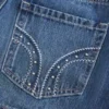 Lavt sittende miniskjørt i denim med nitter