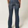 Lavt sittende, mørkvaskede bootcut-jeans med broderi