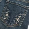 Lavt sittende, mørkvaskede bootcut-jeans med broderi