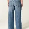 Lavt sittende, mørkvasket baggy jeans med broderi «Class of ’26»