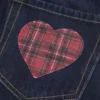 Lavt sittende mørkvasket miniskjørt i denim med rutete lommer