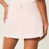 Lavt sittende rosa denim miniskjørt