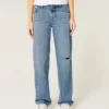 Lavt sittende, slitte jeans i medium vask