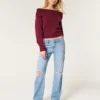 Lavt sittende, slitte jeans med medium vask og avslappet, rett passform