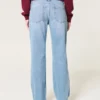 Lavt sittende, slitte jeans med medium vask og avslappet, rett passform