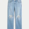 Lavt sittende, slitte jeans med medium vask og avslappet, rett passform
