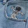 Lysvasket astronautgrafikk Superbaggy jeans
