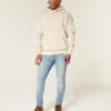 Lysvasket atletisk skinny jeans