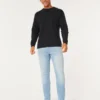 Lysvasket atletisk skinny jeans